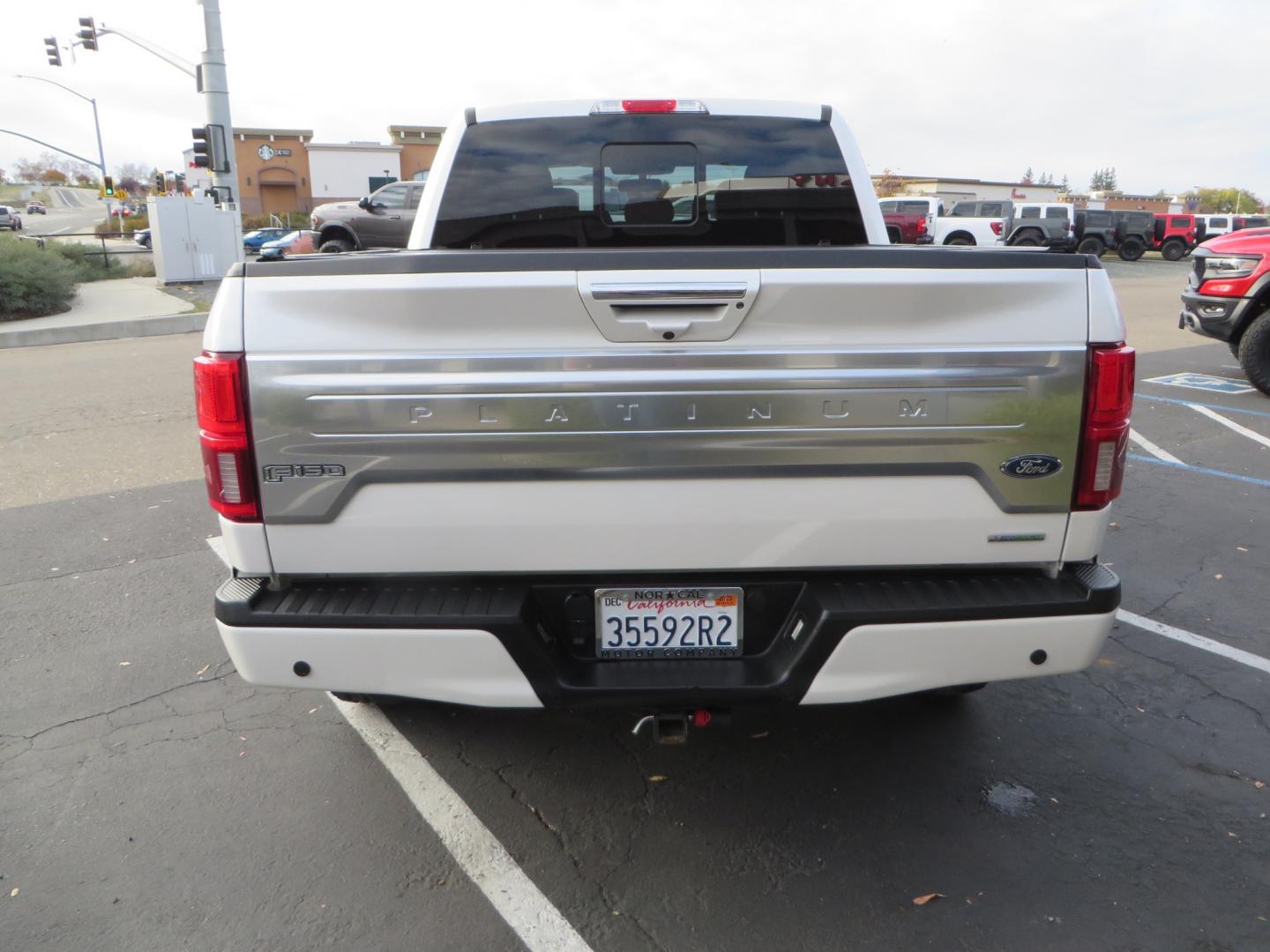 2019 White /BLACK INT W/DARK MARSALA LT Ford F-150 Platinum SuperCrew Cab 4WD (1FTEW1E45KF) with an 3.5L V6 ECOBOOST engine, 10-SPEED AUTO W/TOW MO transmission, located at 2630 Grass Valley Highway, Auburn, CA, 95603, (530) 508-5100, 38.937893, -121.095482 - F150 Platinum featuring a level kit, Fuel Offroad wheels, Toyo AT2 tires, Barricade Front winch bumper, Smittybilt winch, LED light bar, Undercover Ultraflex bedcover, and a Cargo Glide bed system. - Photo#5